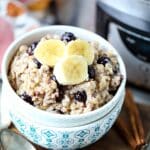 A bowl of crock pot oatmeal with blueberries.