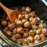 Slow cooker teriyaki meatballs topped with green onions