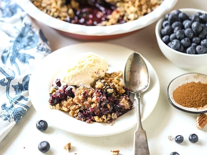 Blueberry crisp with ice cream on top