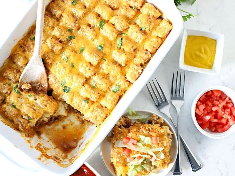 cheeseburger casserole with a serving spoon