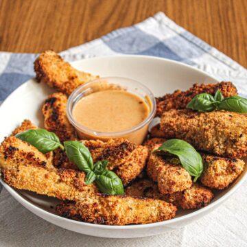 Chicken fingers with dipping sauce.