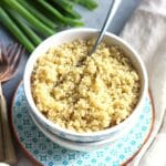 Quinoa in a bowl with a fork.