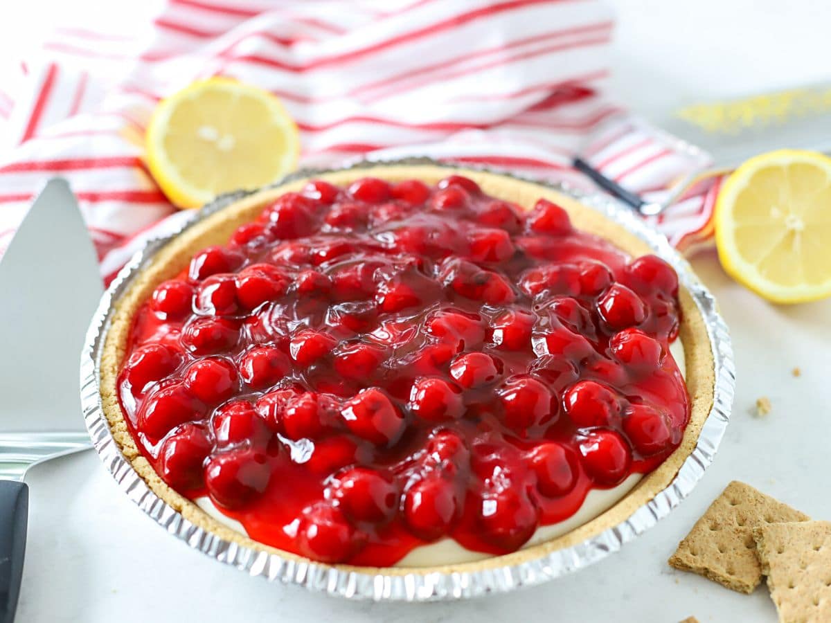 Cherry cheesecake in a pie tin.