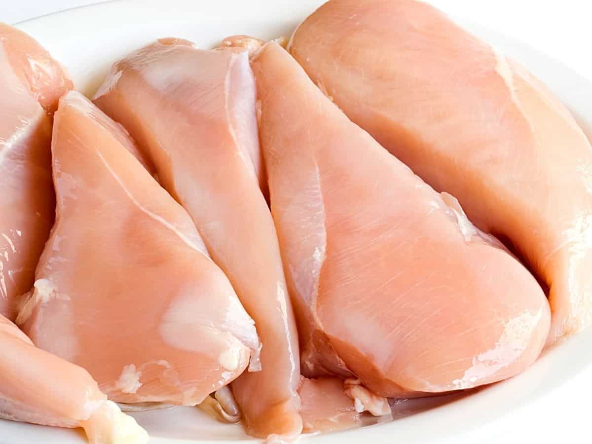 raw chicken on a plate.