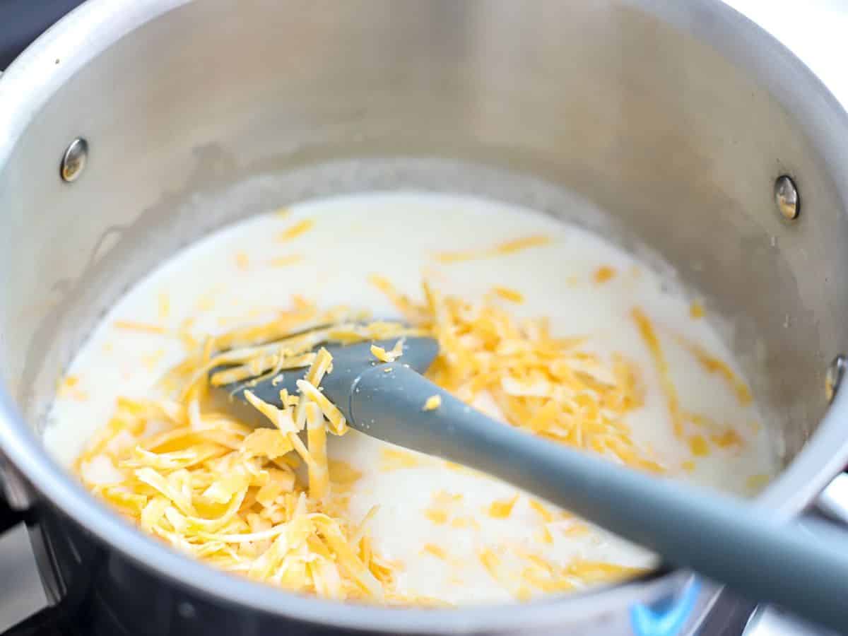 milk, butter, cheese in a pan.