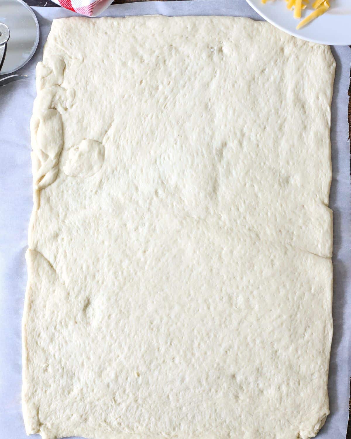 Refrigerated pizza dough rolled out.