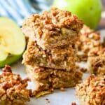 Three stacked baked apple oatmeal bars.