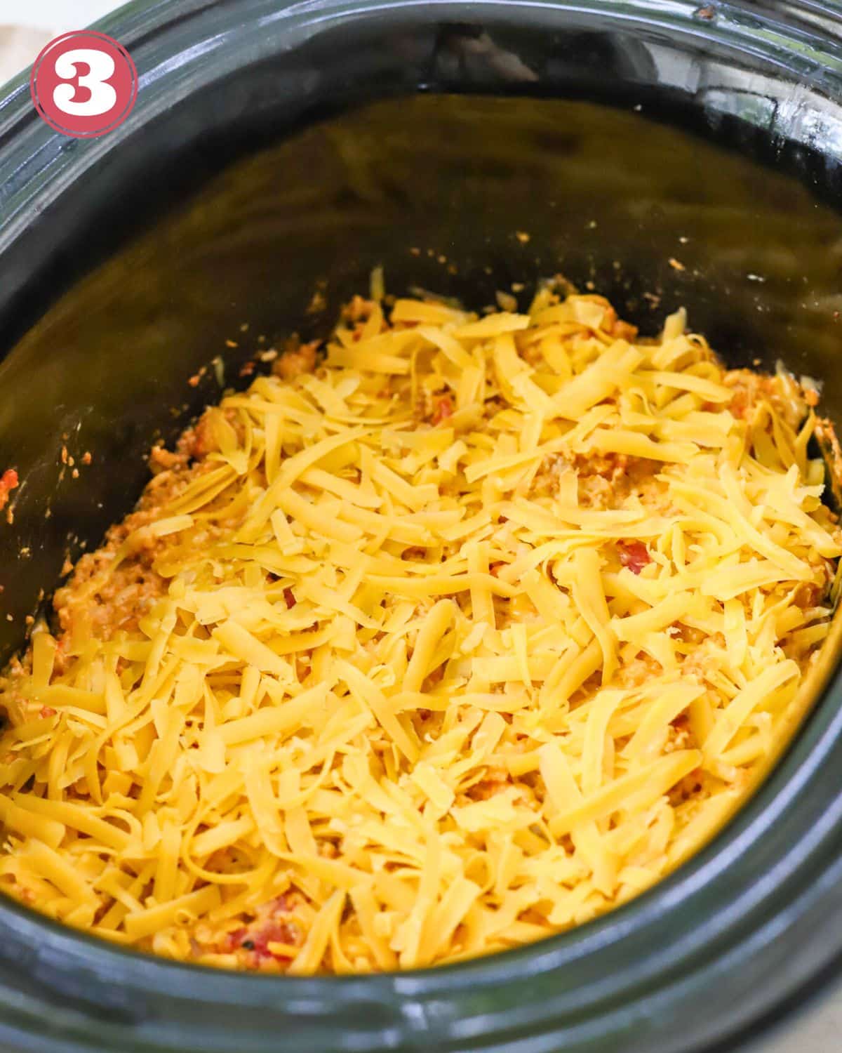 Ground pork casserole topped with cheese.