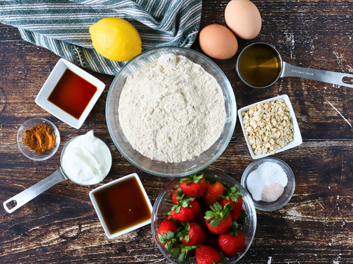 Ingredients to make muffins with fresh strawberries.