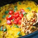 Ground beef pasta cooking in a crock pot.