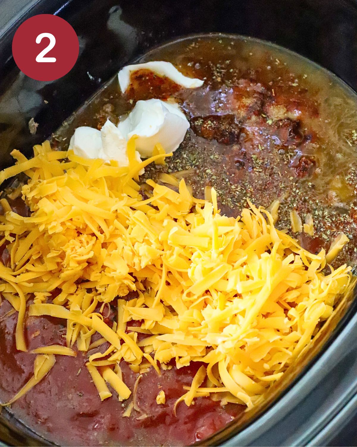 Slow Cooker with the ingredients to make a ground beef casserole.