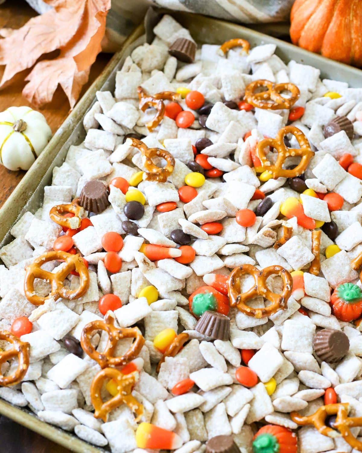 A baking tray full of Halloween muddy buddies.