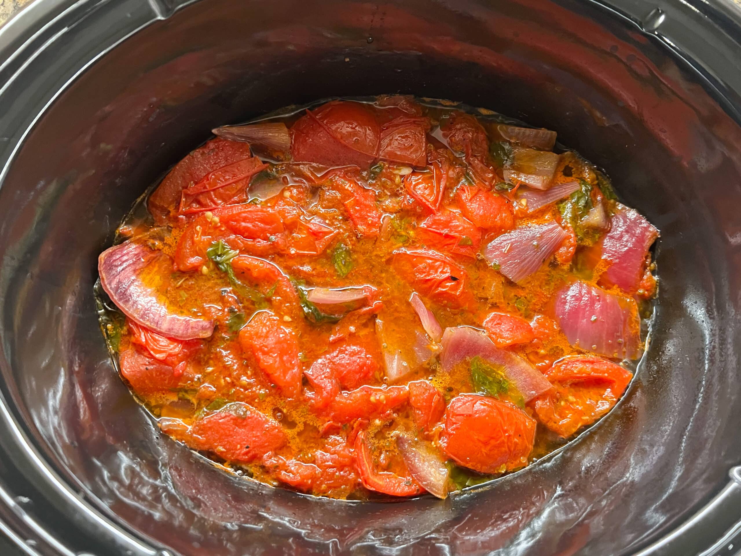 Tomato Basil soup ingredients in slow cooker, after cooking