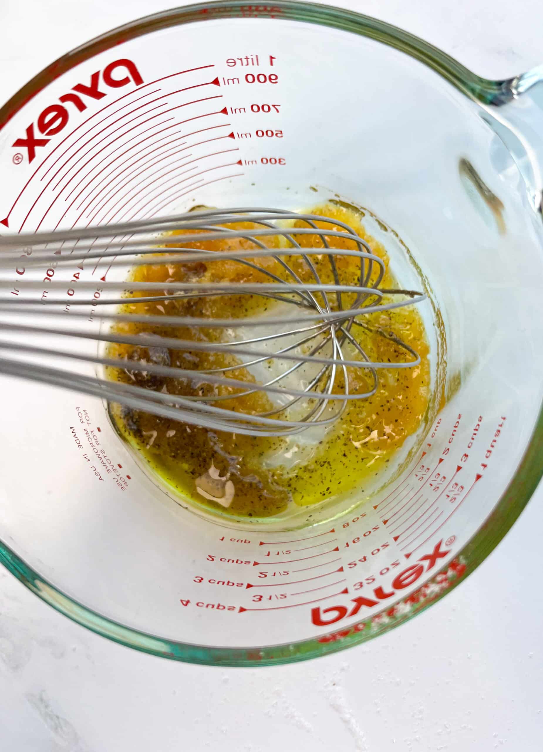 Whisk and Marinade in mixing bowl