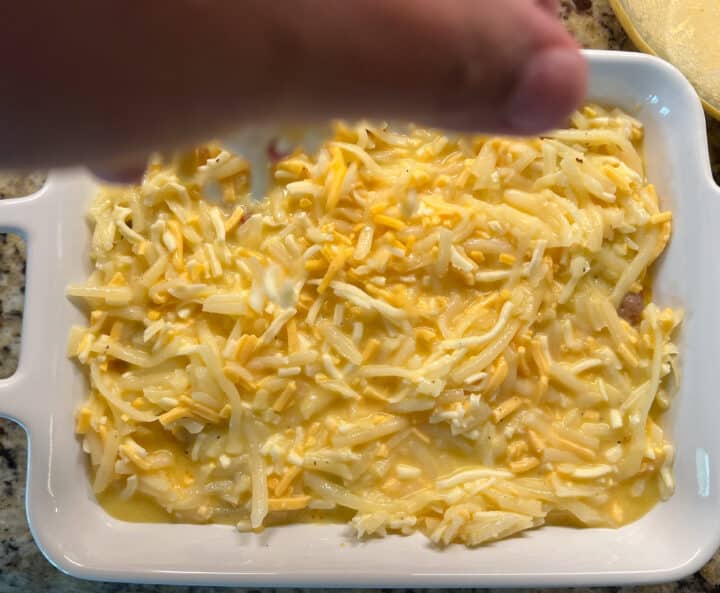 Sprinkling cheese over casserole