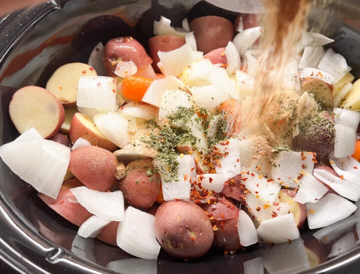 Pouring spices into slow cooker