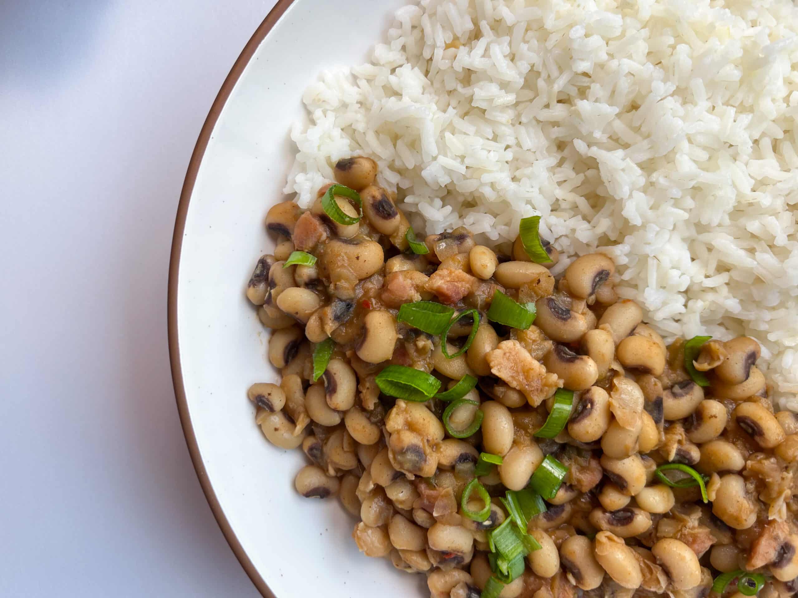 Spicy Black-Eyed Peas with Rice topped with green onions