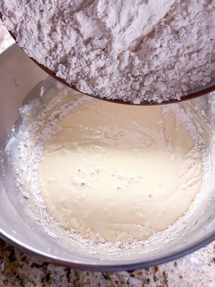 Dry ingredients being poured into wet ingredients