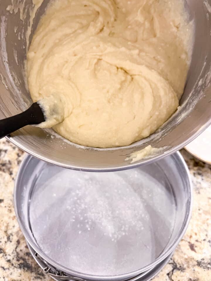 Batter being poured into prepped pan