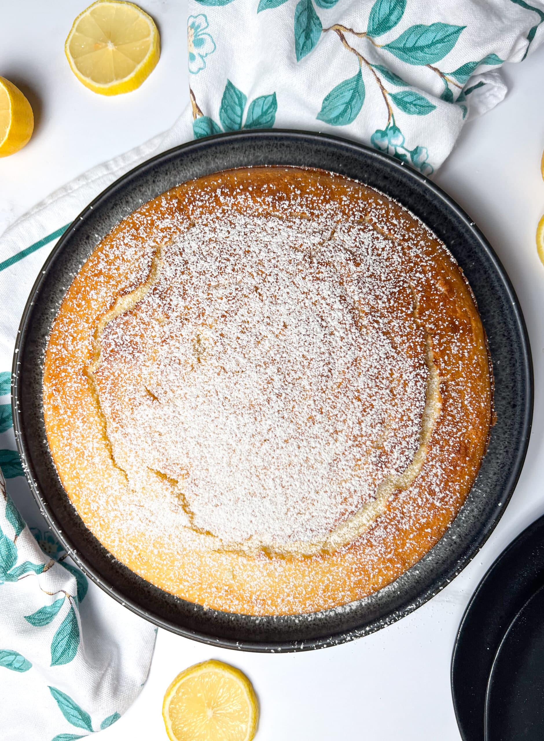 Limoncello Ricotta Cake, dusted with powdered sugar