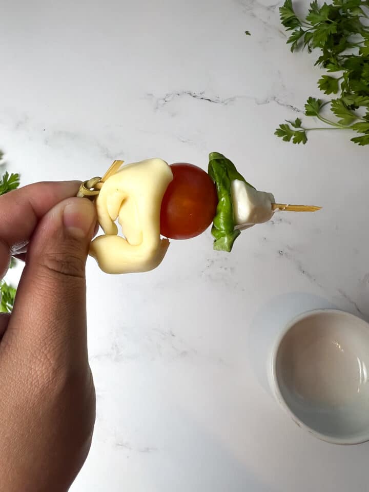 One skewer of tortellini caprese