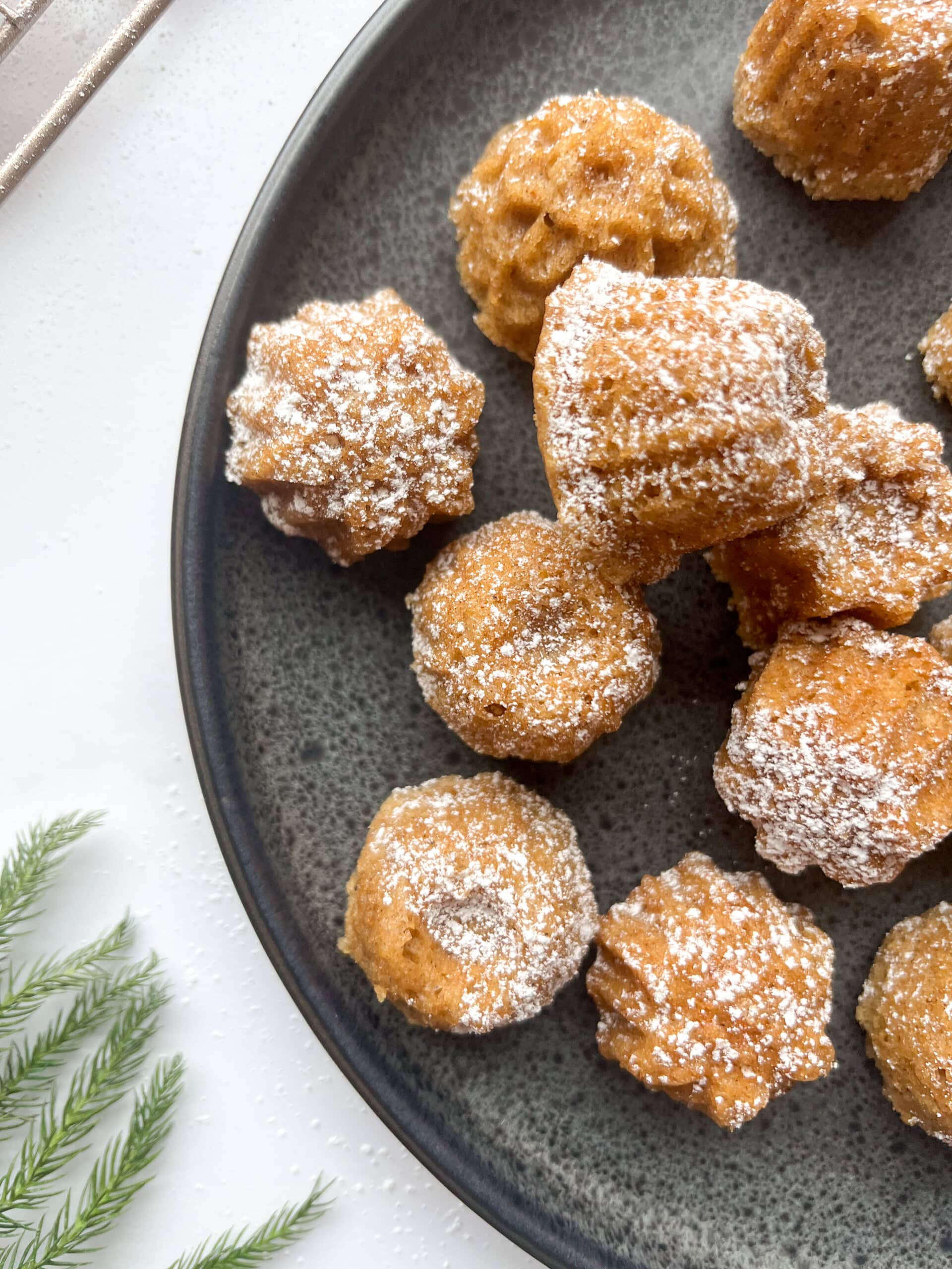 Cardamom tea cakes dusted with powdered sugar, close up