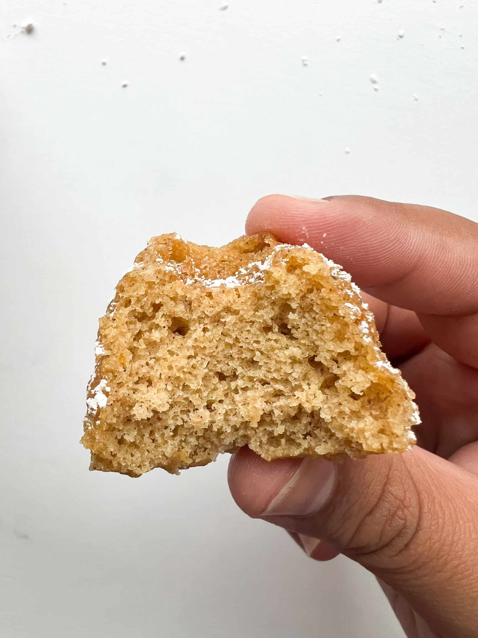 Cardamom tea cake with a bite taken out