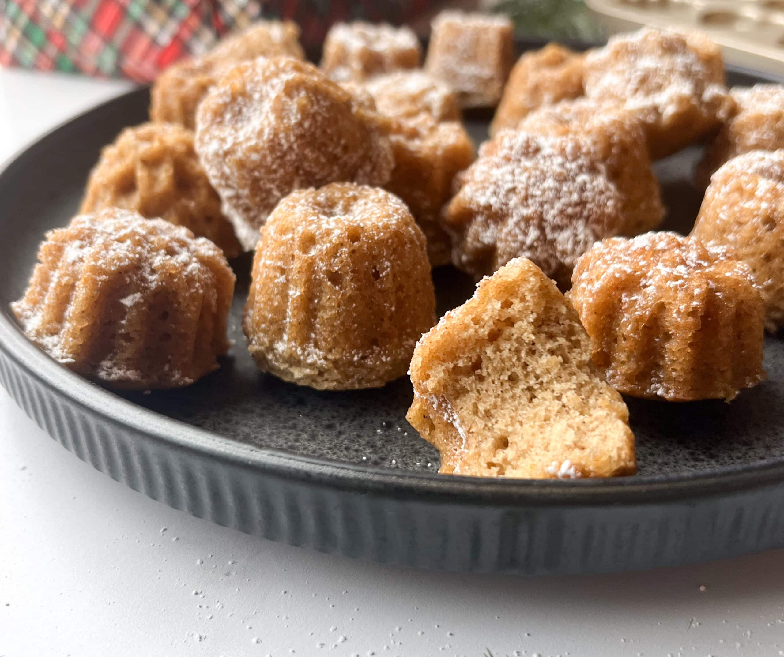 Cardamom tea cakes dusted with powdered sugar from the side