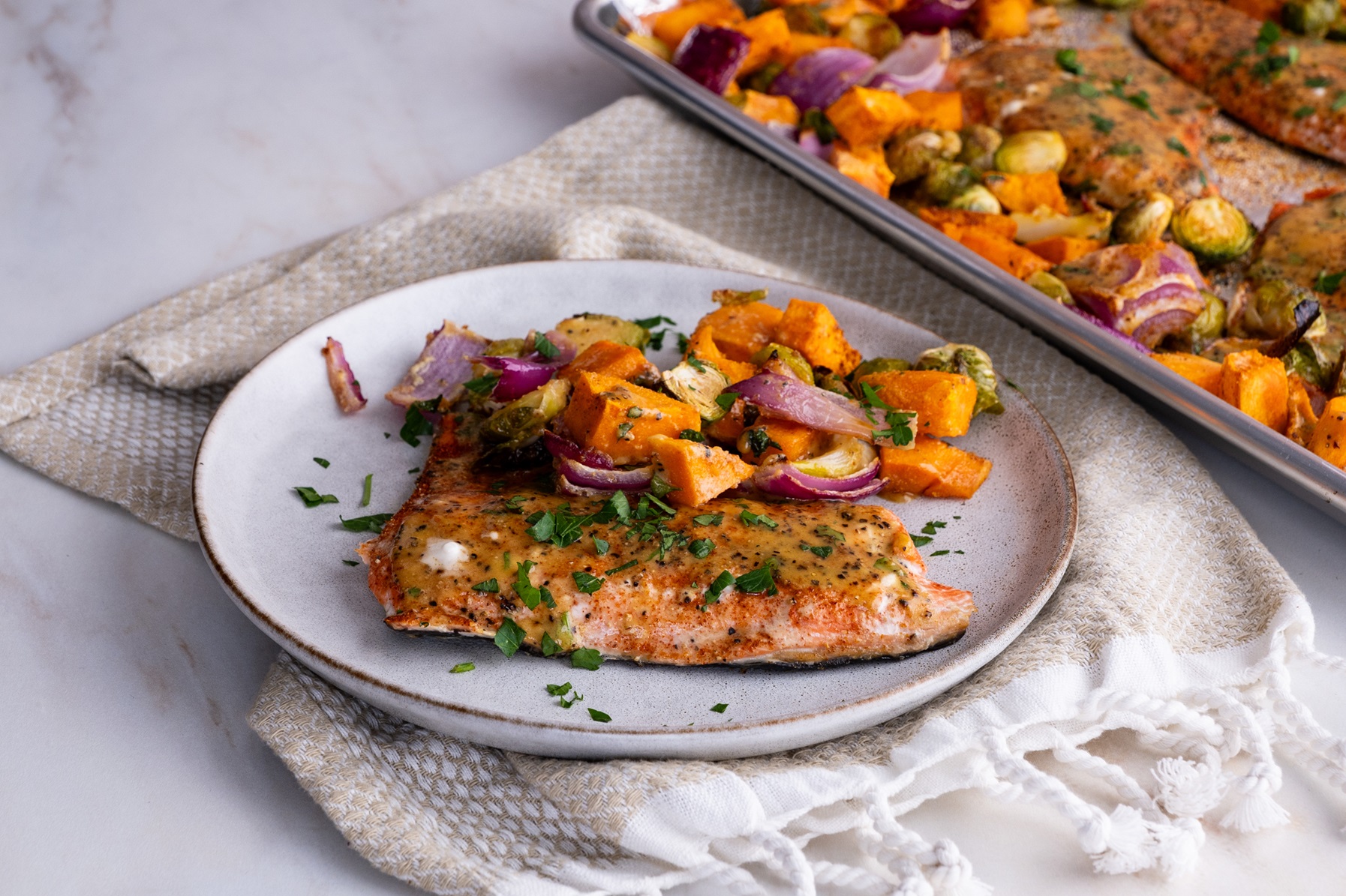 Sheet pan salmon plated with roasted vegetables