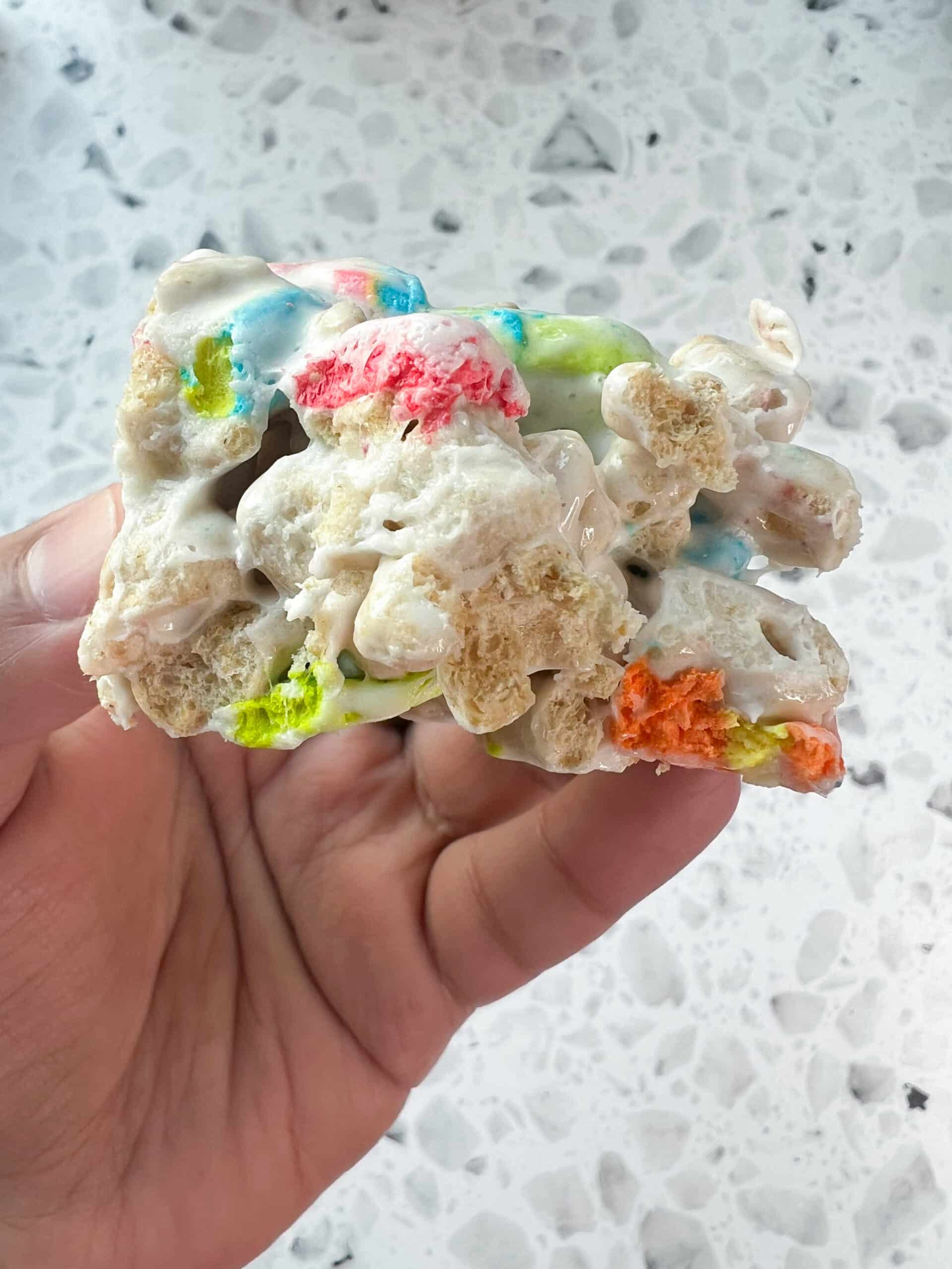 Lucky Charms Cereal Bar Recipe closeup of bar with bite out of it